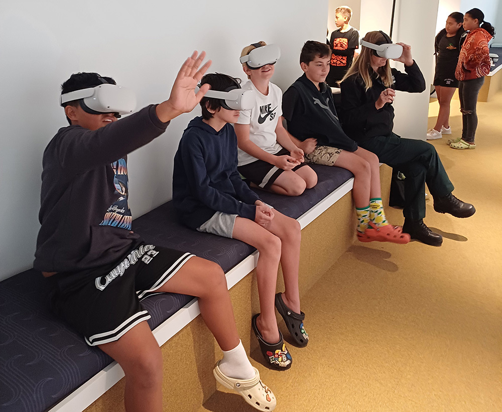 Students wearing VR headsets.