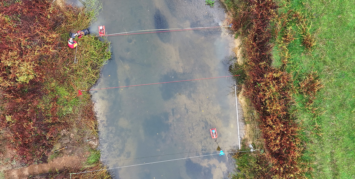 Aerial photo river and hydrology team and equipment.
